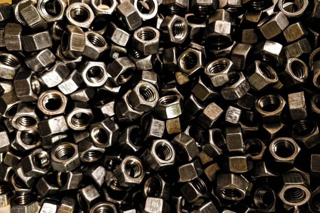 A detailed close-up of metal nuts, perfect for industrial design and hardware use.